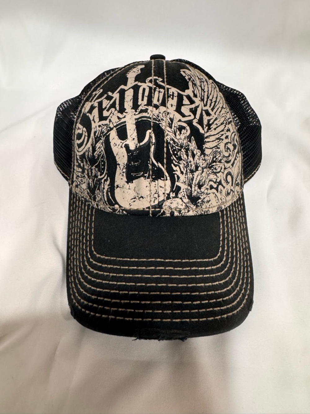 Fender Wings Trucker Cap in black featuring a guitar design Fender Guitars